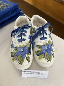 Sneakers decorated with serviette decoupage and paint