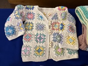 Granny square child's cardigan. Made with tiny granny squares.